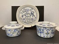 Front view of platter and two covered casseroles