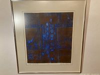 Full view of framed lithograph on wall