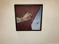 Frontal view of framed painting on wall