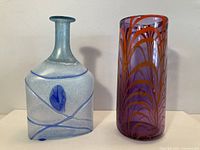 Full view of both art glass vases side by side