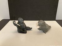 Both carvings side by side