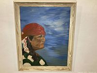 Full view of framed oil painting on wall