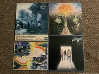 Front covers of all four Moody Blues LPs displayed