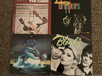 Front covers of all four LP jackets displayed together