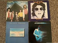 Front jackets of four vinyl LPs