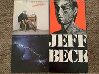 Front covers of four LPs