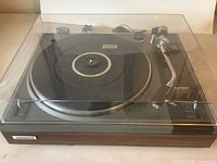 Front view of Pioneer PL-1120 with dust cover closed