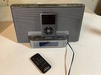 Front view showing Sony docking system with iPod docked and remote