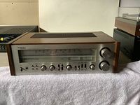 Front view of Technics SA-500 receiver showing faceplate, controls, and wood case
