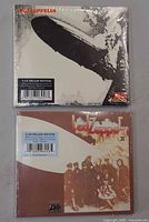 Front covers of both sealed 2-CD sets