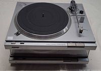 Upper view of two stacked Sony PS-T22 turntables showing platter, tonearm, dust cover on lower unit