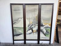 Front view of full three-panel divider showing painting and frame