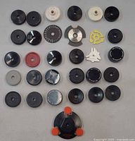 Overview of all 31 45 RPM adapters arranged in rows