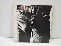 Front sleeve showing jeans image and zipper