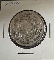 Reverse of 1941 Canada 50 cents showing coat of arms and date