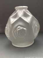 Full view of frosted glass vase front showing embossed rose and diamond motifs