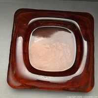 Top view showing square shape and amber glass