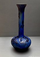 Front view showing etched floral pattern and bulbous base