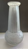 Full front view of frosted etched glass vase showing fluted neck and floral relief base