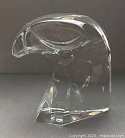 Front profile of clear crystal falcon head paperweight