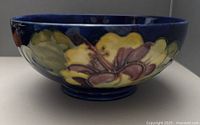 Side view of Moorcroft Hibiscus bowl, exterior floral decoration visible