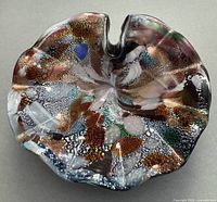 Top view showing multicolour murrine pattern and ruffled rim