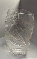 Front view of clear textured glass vase showing ice-like surface and overall shape