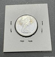 1957 quarter obverse in cardboard flip