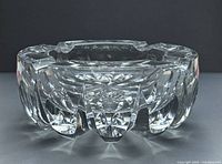 Side view of St. Louis cut crystal ashtray showing faceted sides and scalloped rim