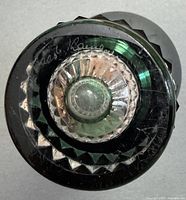 Bottom view showing signature, cut pattern and scratches