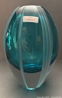 Front view of aqua ribbed crystal vase with Waterford label
