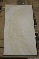 Close-up of single 12"x24" matte porcelain tile showing colour and finish