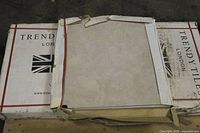Two boxes of Trendy Tiles London on pallet with sample tile on top