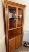Corner oak china cabinet closed