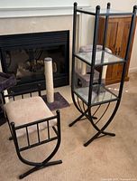 Étagère and stool in front of fireplace