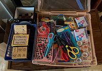 overview of blue basket with stamps and storage tote with craft tools