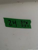 Green tape showing lot number and handwritten 35 x 23