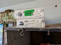 Front view of two Clarion 9771RT marine stereos stacked