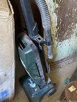 Full view of Dirt Devil Featherlite vacuum showing body, hose, and base