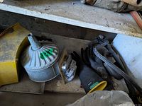 Shelf view with funnel, gloves, respirator cartridges, hoses