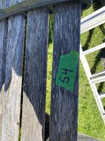 Close-up of weathered wood slats and surface wear