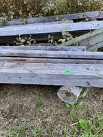 weathered grey beams on ground