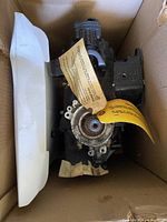 Powerhead assembly inside shipping box with foam end cap visible