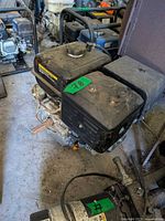 Top and side view of engine showing fuel tank, air filter housing and overall condition