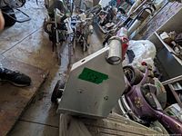 Chassis lying horizontally among other equipment