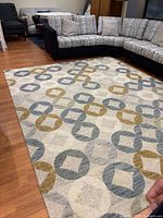 Full view of geometric wool rug in room