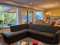 Front view of assembled sectional showing overall shape, upholstery colour and configuration