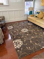Area rug in living room setting showing full size and pattern