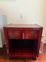 Front view of one nightstand showing drawer, open shelf and overall design