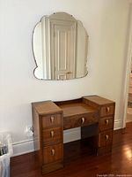 Vanity front view with wall mirror above